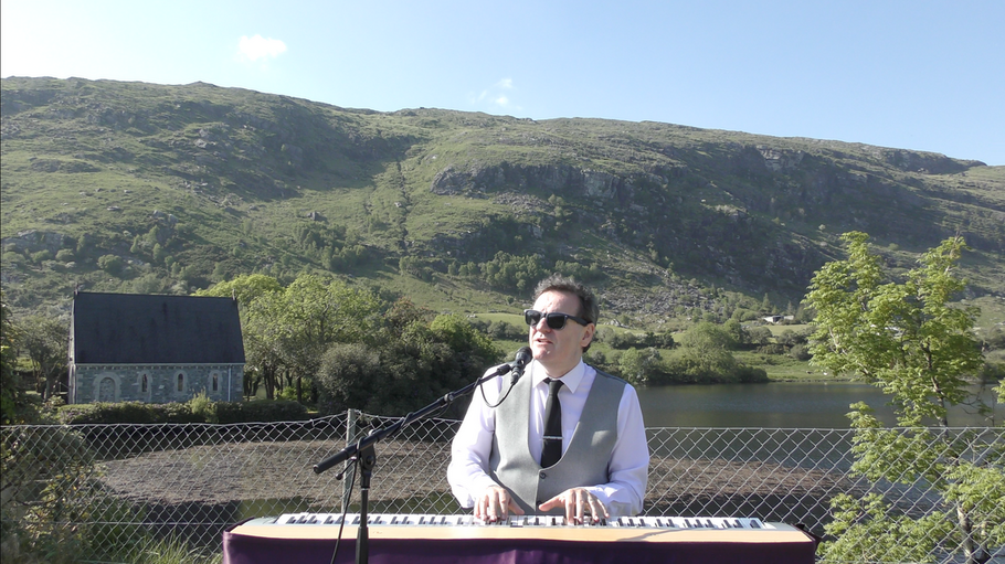 Picture of Sean De Burca , Wedding Singer and piano Player from Ireland by a lake in County Cork